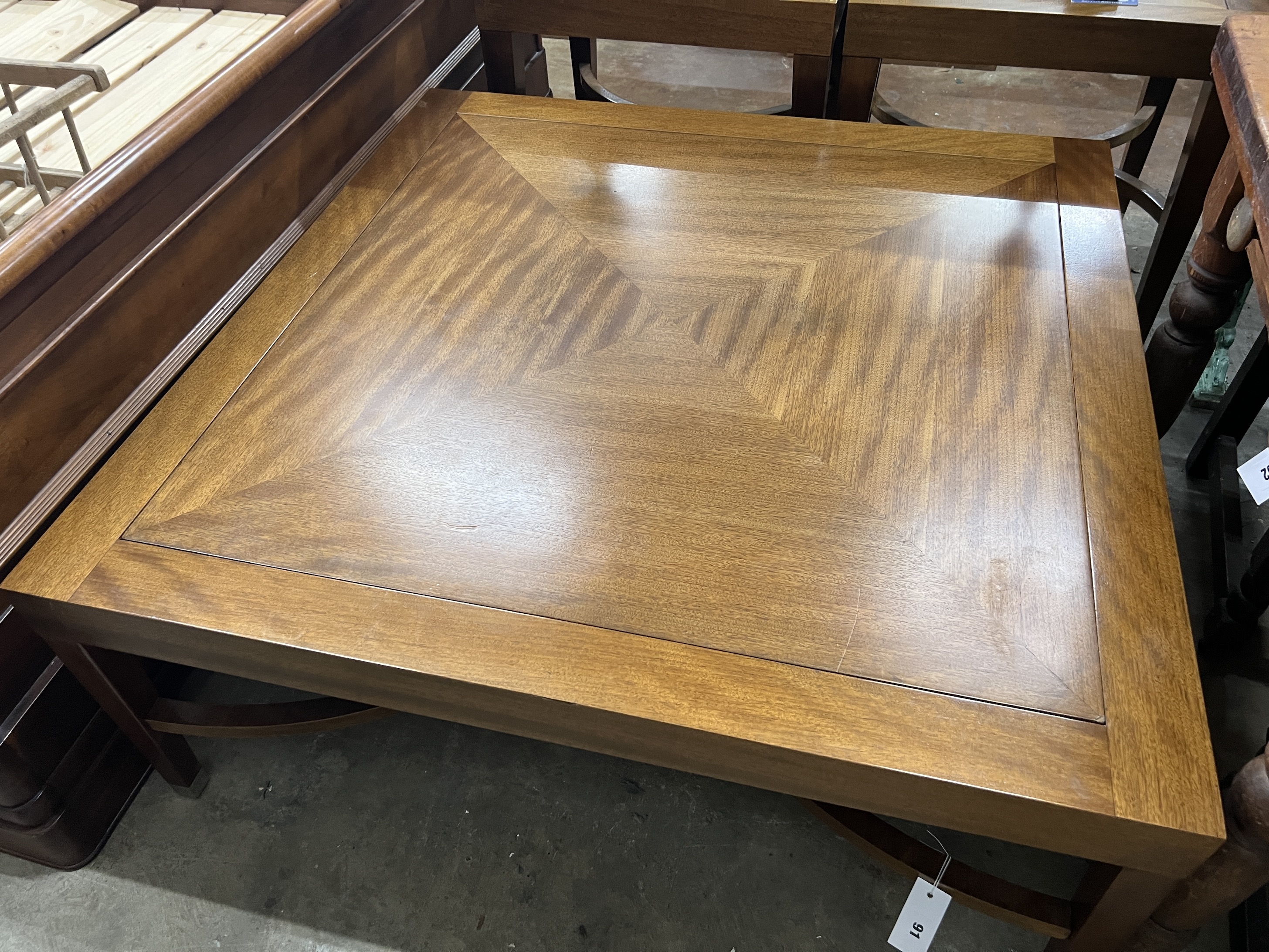 A contemporary South African mahogany square coffee table, width 110cm, height 45cm